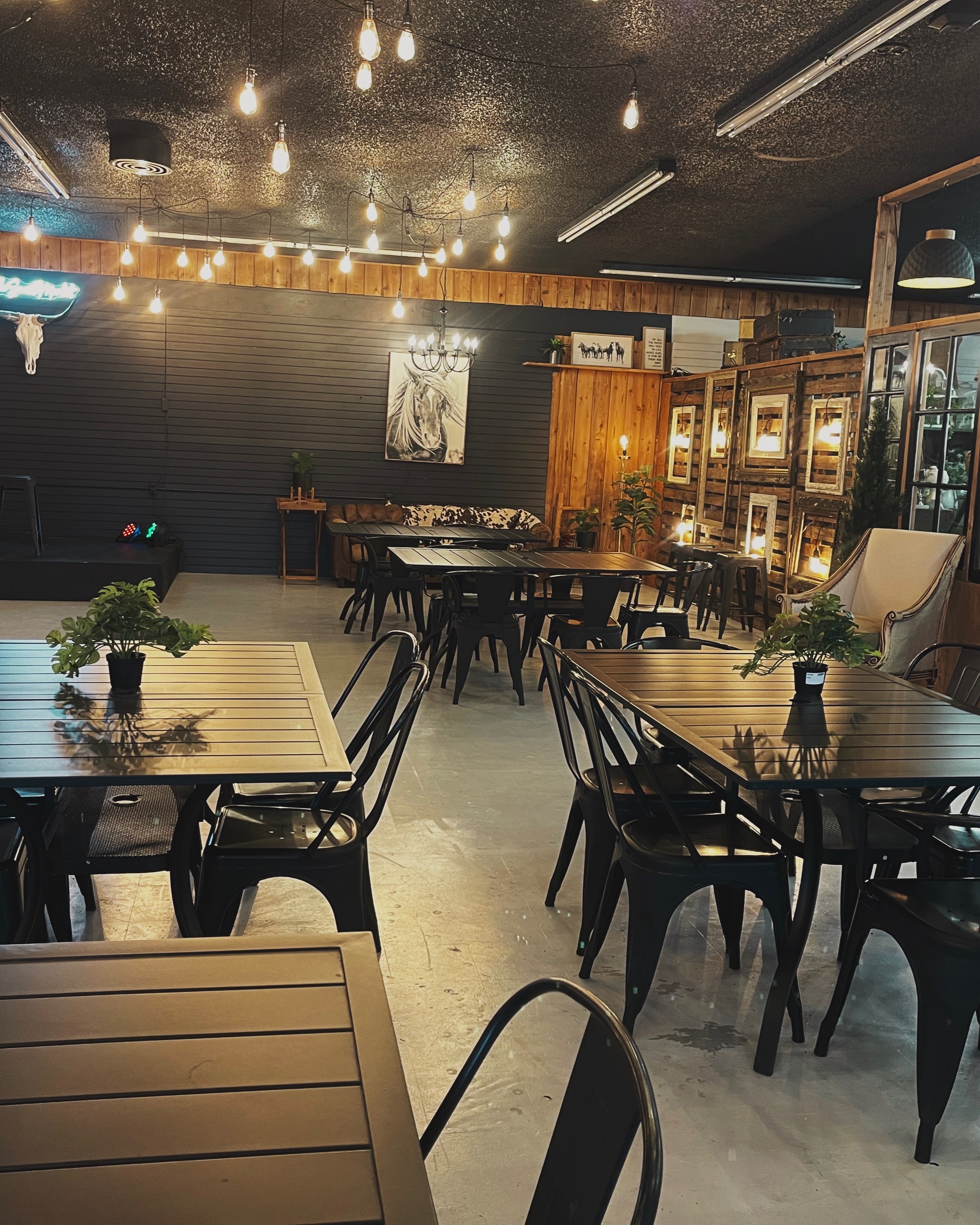 Indoor dining area with rustic decor and string lights